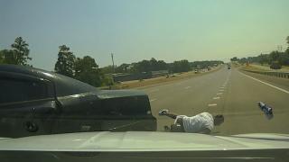 Officer Clings to Getaway Car Officer Clings to Getaway Car